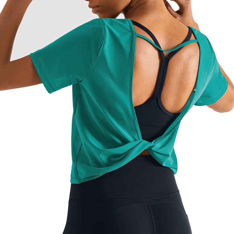 Back view of a woman wearing a stylish quick-drying open-back sports T-shirt in vibrant green, perfect for workouts and casual wear.